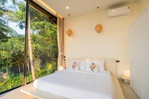 เตียงในห้องที่ Seaview Villa Ganesha +83 ภาพ