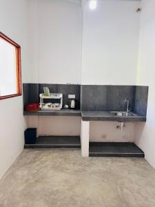 a kitchen with a sink and a counter in a room at Sun Bird Villa in Elagawagoda +15 photos