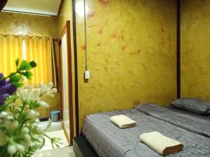 Postel nebo postele na pokoji v ubytování Libong de loft ลิบงเดอลอฟท์