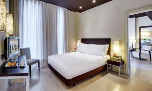 Postel nebo postele na pokoji v ubytování Sercotel Boulevard Vitoria-Gasteiz