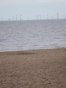 a large body of water with wind turbines in the distance at Skegness Ingoldmells near Skegness raceway holiday let by Sophia in Ingoldmells +6 photos