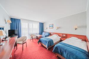 Postel nebo postele na pokoji v ubytování Hotel Lidia Spa & Wellness