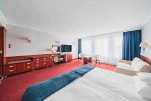 Postel nebo postele na pokoji v ubytování Hotel Lidia Spa & Wellness