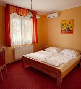Tempat tidur dalam kamar di Euro Panzio