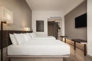 Voodi või voodid majutusasutuse AC Hotel by Marriott Punta Cana toas