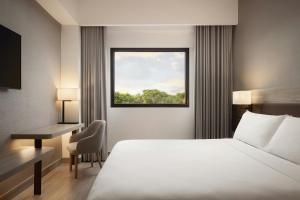 Voodi või voodid majutusasutuse AC Hotel by Marriott Punta Cana toas
