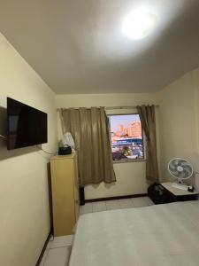 Μια τηλεόραση ή/και κέντρο ψυχαγωγίας στο Apartamento Central Salvador