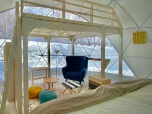 Ein Bett oder Betten in einem Zimmer der Unterkunft 焚き火キャンプ場 Hokkaido Glamping - TAKIBI
