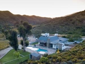 an aerial view of a house with a swimming pool at Ludicks Farm in Montagu +16 photos