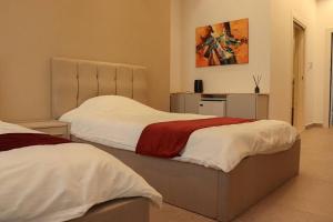 Fgroup tesisinde bir odada yatak veya yataklar +6 fotoğraf