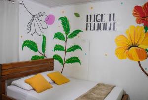 Postel nebo postele na pokoji v ubytování Hostal Síndigo