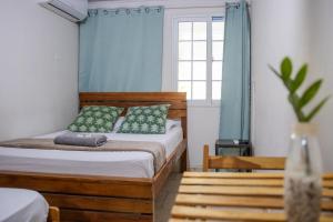 Postel nebo postele na pokoji v ubytování Hostal Síndigo