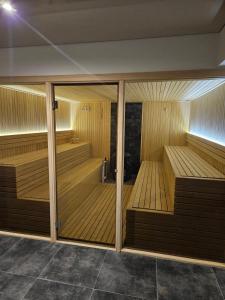 a sauna with wooden saucers in a building at Mokoš apartman, Residence hill A35, minimum dve noći in Kopaonik