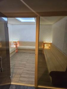 a view of a room with a glass door at Mokoš apartman, Residence hill A35, minimum dve noći in Kopaonik
