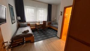 TV a/nebo společenská místnost v ubytování Hotel Gästehaus Linden