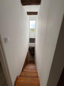 a hallway with a stairway with a window at Superbe T2 Bolquère in Bolquere Pyrenees 2000
