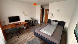 TV a/nebo společenská místnost v ubytování Hotel Gästehaus Linden