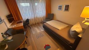 Postel nebo postele na pokoji v ubytování Hotel Gästehaus Linden