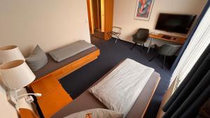 Postel nebo postele na pokoji v ubytování Hotel Gästehaus Linden