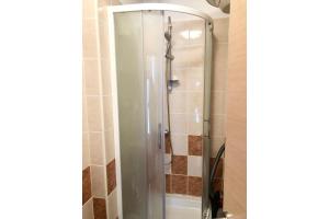 a shower with a glass door in a bathroom at Apartment Bonaca in Rogoznica +16 photos