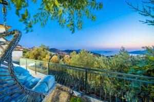 a view from the balcony of a house at KaşKalkan Deniz manzaralı Havuzlu Bahçeli Villa in Kas