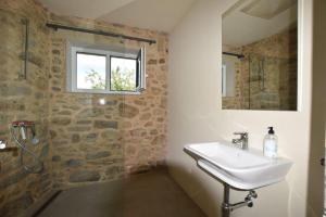 a bathroom with a sink and a window at Casa La Pedrosa - Tedin in Cee +48 photos