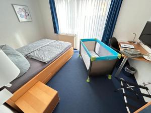 Postel nebo postele na pokoji v ubytování Hotel Gästehaus Linden