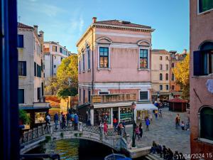 a bridge over a canal in a city with buildings at Venice Tourist House in Venice