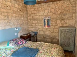 Voodi või voodid majutusasutuse Gîte de charme champêtre toas
