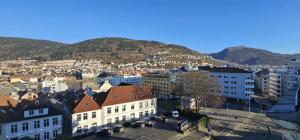 a city with buildings and mountains in the background at Best view in town in Bergen