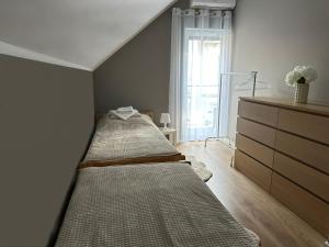 Posteľ alebo postele v izbe v ubytovaní Apartament Mushellka - Dziwnówek Horizon Park , 2 sypialnie i salon