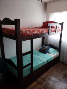 a couple of bunk beds in a room at Frente al mar in Montevideo