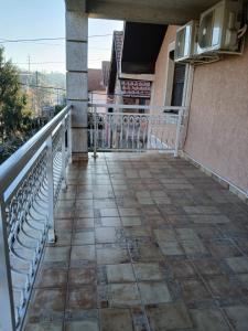 a balcony of a house with a tile floor at SD Apartmani Stan Na Dan in Smederevo