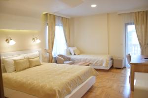Tempat tidur dalam kamar di IN Hotel Zlatar ex Zlatarski Biseri