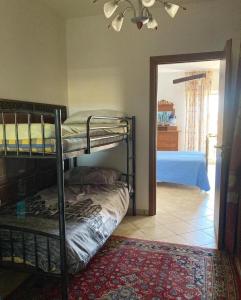 Giường trong phòng chung tại casa il carretto