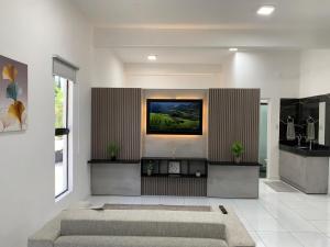 TV a/nebo společenská místnost v ubytování Casa y Monoambiente en Pilar, Py