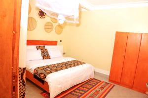 Letto o letti in una camera di Kirungi Vacation Homes