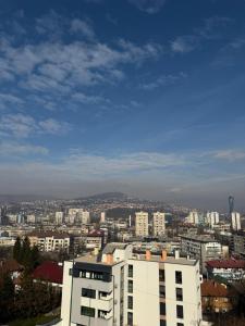 a view of a city with a white building at Avdina Luxury Apartment in Sarajevo