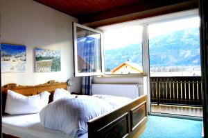 Postel nebo postele na pokoji v ubytování Hotel Sonnleitn