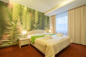 Posteľ alebo postele v izbe v ubytovaní Hotel Slovan