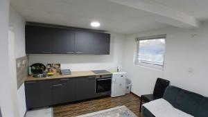 a kitchen with a sink and a counter top at Vlašić vikendica BHL in Šišava