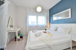 Łóżko lub łóżka w pokoju w obiekcie Luxury Apartments Marija
