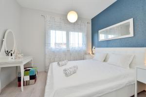 Łóżko lub łóżka w pokoju w obiekcie Luxury Apartments Marija