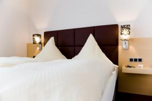 Postel nebo postele na pokoji v ubytování Hotel Lücke Rheine