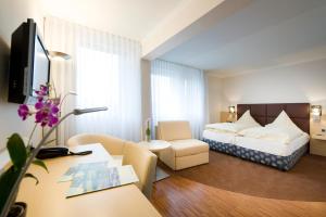 Postel nebo postele na pokoji v ubytování Hotel Lücke Rheine