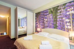 Posteľ alebo postele v izbe v ubytovaní Hotel Slovan