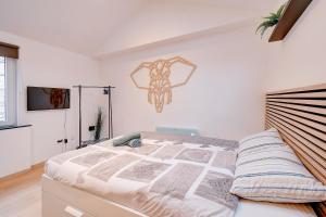 A bed or beds in a room at Le cocon de Chênée - Liège