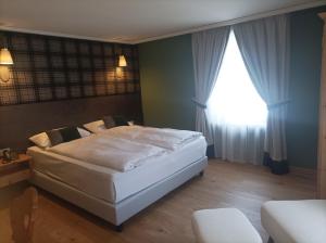 Postel nebo postele na pokoji v ubytování Hotel Meierhof