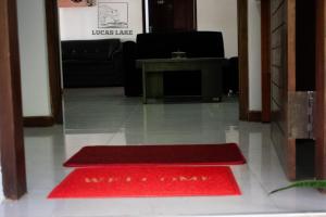 a red rug on the floor in a room at Yala Lucas Lake Hotel in Tissamaharama