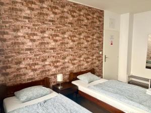 Posteľ alebo postele v izbe v ubytovaní Žižkov Cosy Studio Apartments